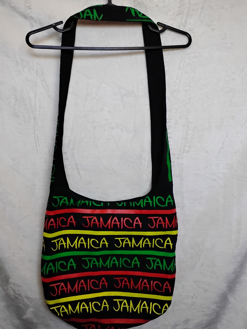 Robin Ruth Jamaica Stripe Crossbody Bag in Black, Red, Yellow, Green